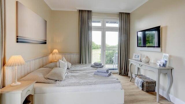 Ferienwohnung in Fehmarn OT Fehmarnsund - Strandresidenz Vogelflug Meerblick Porschen - Bild 4